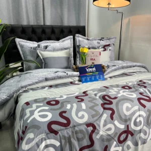 Edredón estampado moderno y abrigado sobre cama doble con diseño decorativo para la habitación